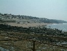 Cliff Road and Loe Bar Road above the beach. Seine house is in the centre. 30 May 2003.